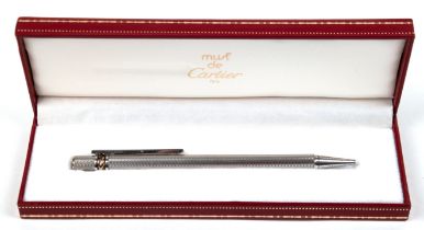 Kugelschreiber von Cartier, sog. "Must de Cartier", silberfarben, teilw. farbig emailliert, Korpus