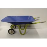 Vintage child's toy wheelbarrow in blue and green factory finish. Collection only.