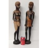 (2) very tall ethnic carved wooden statues measuring 60cm  Shipping Group (A).