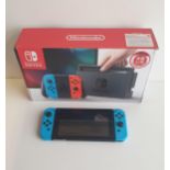 Nintendo switch with original box and bag. Shipping Group (A).