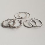 3 pairs of silver hoop earrings. Shipping Group (A).