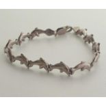 .925 silver dolphin design link bracelet. Shipping Group (A).