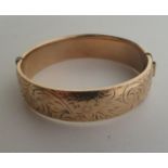 9ct gold metal core bangle. 31.7g Shipping Group (A).