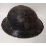 Original WWII Brodie helmet with liner and strap. Shipping Group (A).