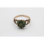 9ct gold emerald floral cluster ring featuring openwork shank. Size: Q, Weight: 1.7g. Shipping Group