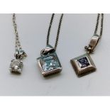 3 silver hallmarked pendants and chains Shipping Group (A).
