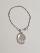 Silver and Mother of Pearl pendant on chain. Shipping Group (A).