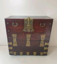 Oriental origin wood and brass chest, H:90 x L:86 x D:45 cm. Collection only.