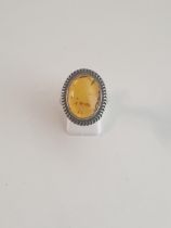 Silver and amber set ring, size T½. Shipping Group (A). / Collection only.