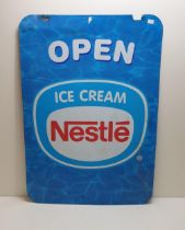 Nestlé metal advertising sign measuring 70x50cm. Collection only.