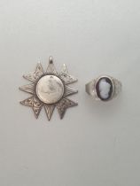 Silver cameo set ring together with a silver fob. Shipping Group (A).