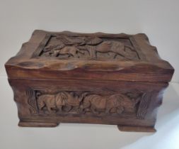 Good quality African origin wooden trunk having carved Elephant and Rhinoceros decoration. H:32 x