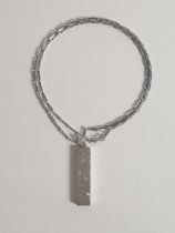 Hallmarked silver ingot pendant on chain. Shipping Group (A).