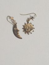 9ct gold moon and sun earrings. Shipping Group (A).