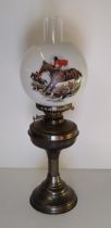 Vintage oil lamp complete with funnel and milk glass shade decorated with hunting scene.