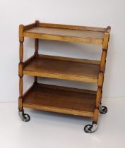 Good quality oak 3-tier tea trolley on castors. Collection only.