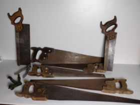 7 vintage hand saws, 6 of which being by Disston (USA) the other being Canadian Medallion,