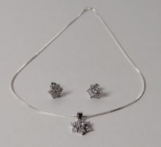 .925 silver and cubic zirconia necklace and earring set. Shipping Group (A).