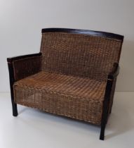 Wooden-frame and rattan 2-seater settee. Collection only.