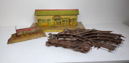 Vintage model railway track and tinplate buildings. Shipping Group (A).