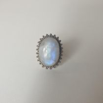 .925 silver and moonstone set ring, size Q½. Shipping Group (A).