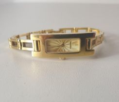 Gucci ladies gold plated quartz wrist watch. Shipping Group (A).