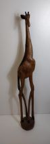 Very tall wooden carving of a giraffe standing H:150 cm. Collection only.