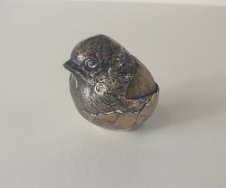 An antique sterling silver pin cushion in the form of a hatching chick by Sampson Mordan & Co.
