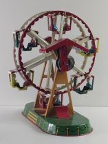 Vintage German mechanical clockwork lithographed tinplate fairground ferris wheel toy by Josef