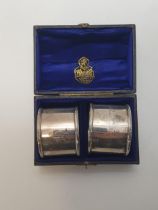 Pair of silver napkin rings, Chester hallmark. In presentation case having fitted interior. Shipping