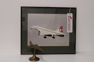Concord themed lot comprising; framed and glazed photograph, swing ticket and a brass model.
