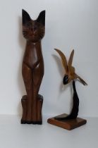 2 carved wooden figures, one being of a sitting cat, the other a kingfisher. Tallest standing 50 cm.