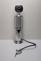 An unusual drinks dispenser in the form of a petrol pump, standing 49cm. Shipping Group (A).