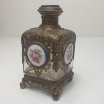 An early 19th century French grand tour scent bottle. gilt ormolu mounts over clear blown glass