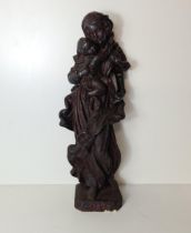 A very heavy cast statue of Madonna and Child, standing 52cm. Collection only.