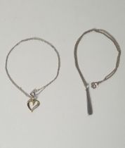 .925 silver pendant together with a gold-plated on silver heart-shaped pendant plus chains. Gross