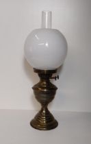 Vintage brass oil lamp with milk glass globe. H:50 cm. Collection only.