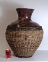 A large contemporary jerissa stone and woven olive branch floor vase. H:63 cm. Collection only.