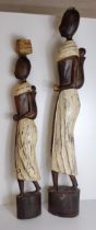 2 large African carved wooden figures. Tallest standing H:100 cm. Collection only.