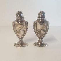 Pair of silver pepperettes, 64g, Birmingham hallmark. Shipping Group (A).