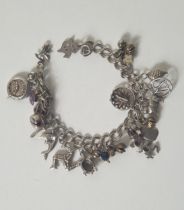 .925 silver charm bracelet and charms. Approx 18cm, 40g. Shipping Group (A).