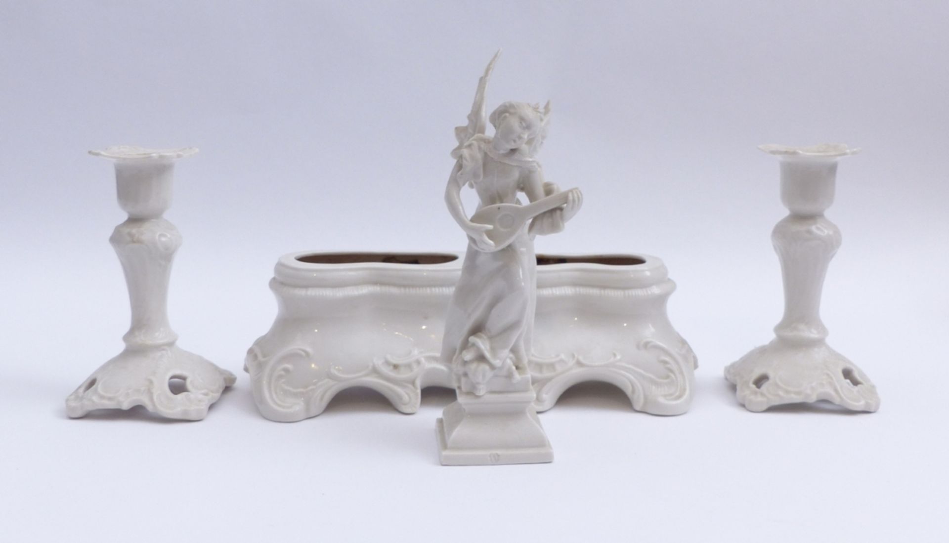 Table vase with two candlesticks and an angel figurine