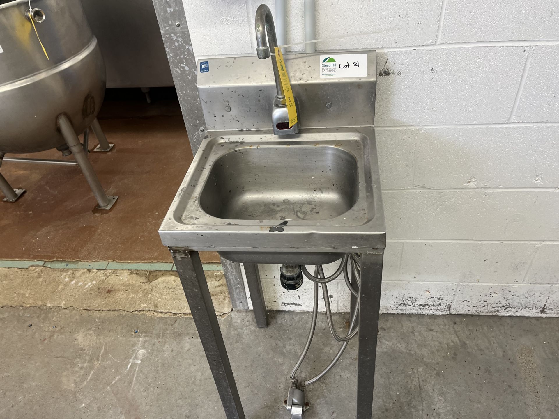 Hand wash station with foot pedal