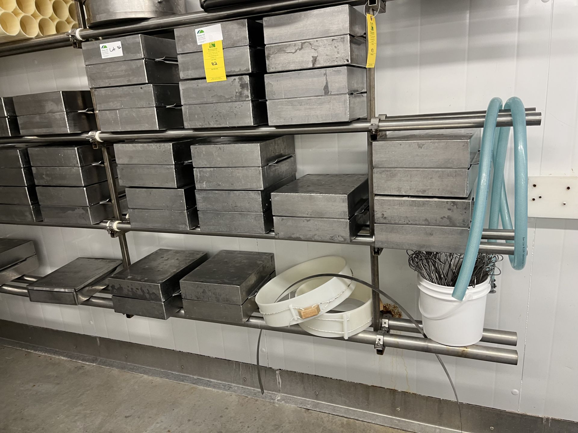 Stainless wall rack for cheese moulds