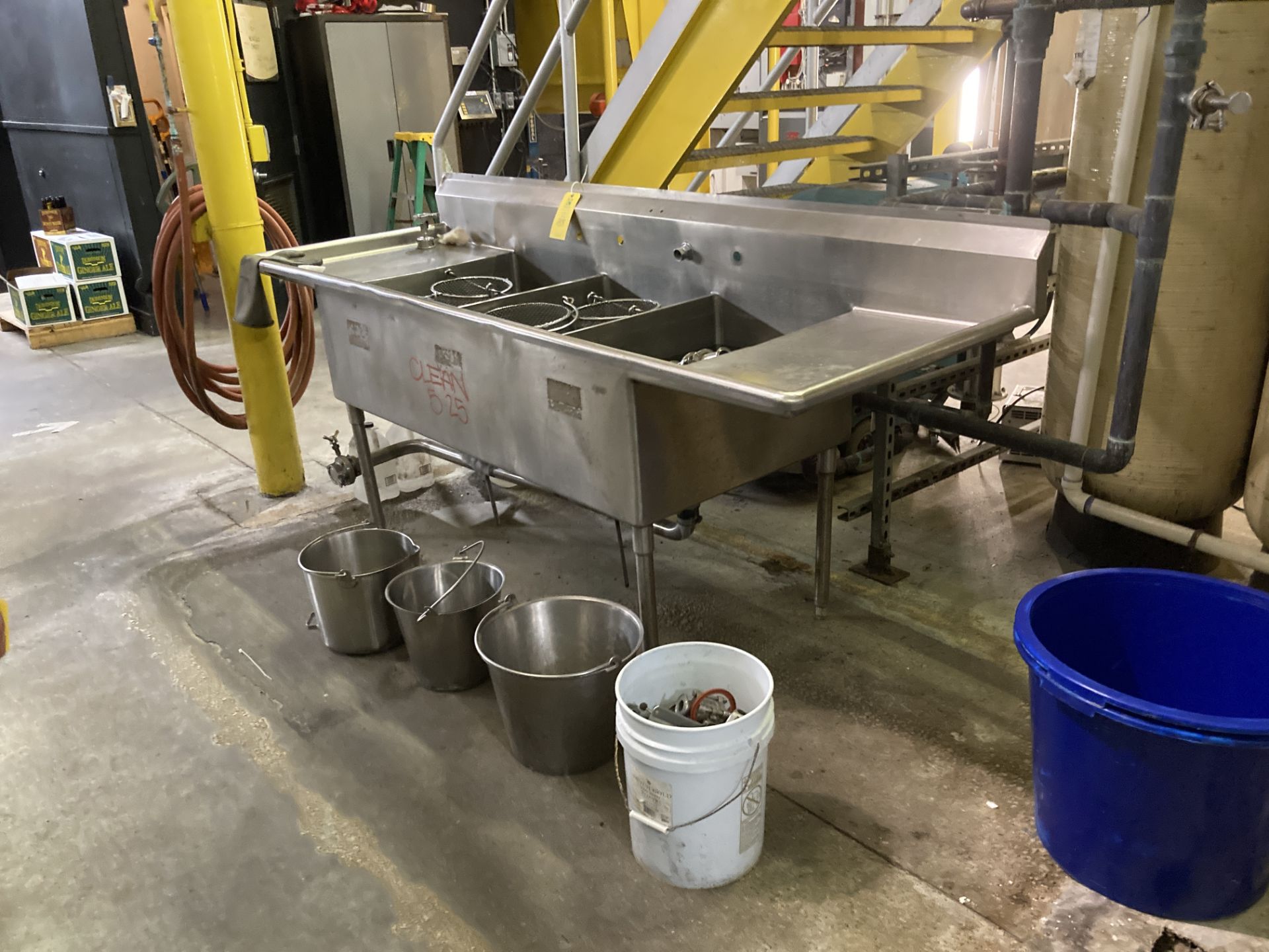 Stainless 3 bowl sink with content of sight glasses, clamps, butterfly valves, baskets, and