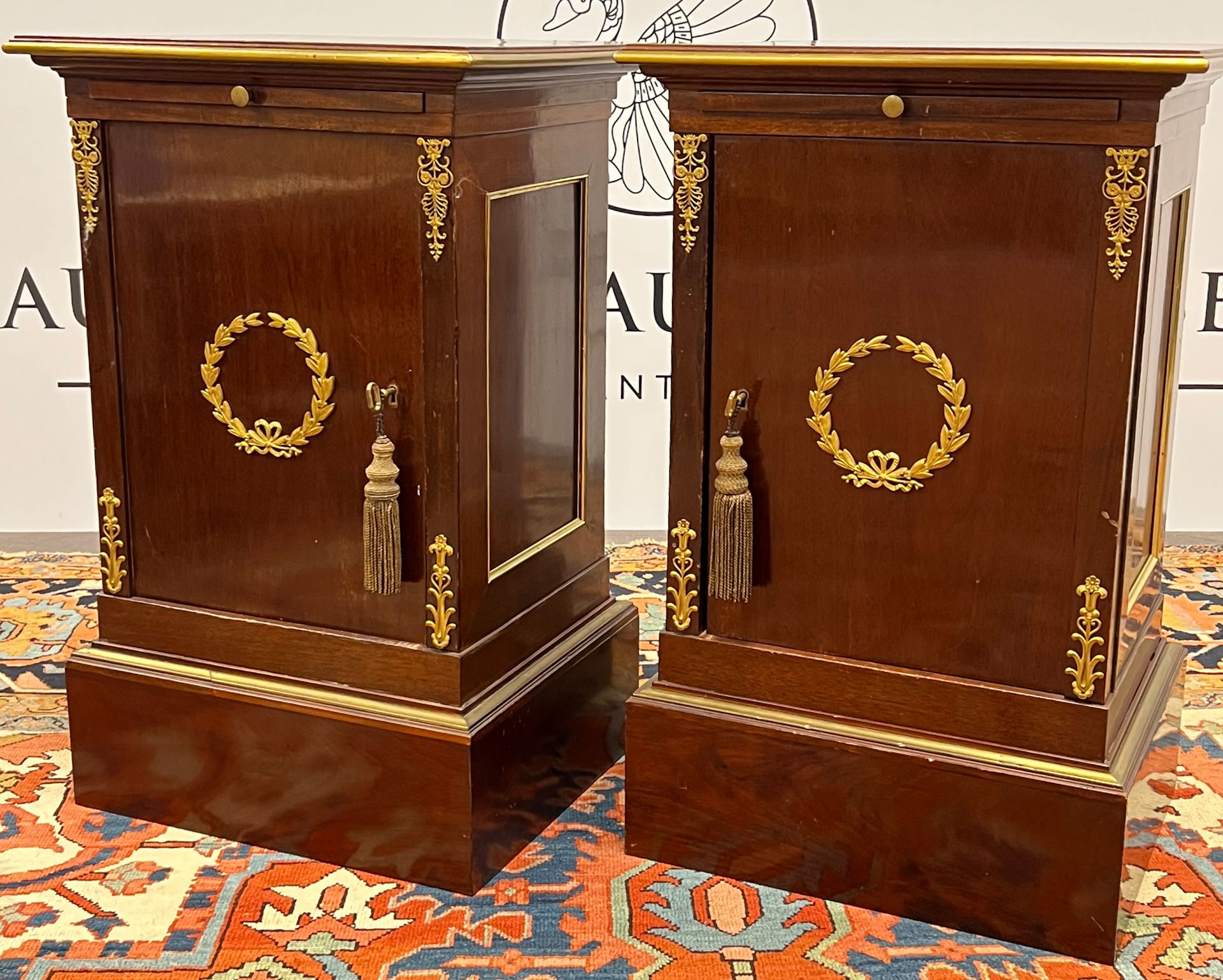 Pair of antique side cabinets with writing tableaus. Empire.