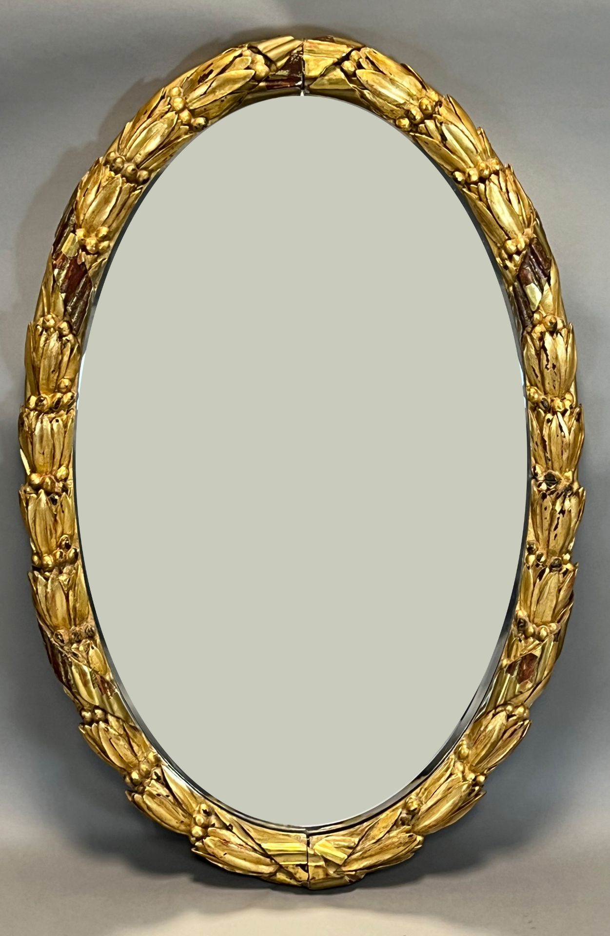 Oval mirror. Gilded. Biedermeier. 1st half of the 19th century.