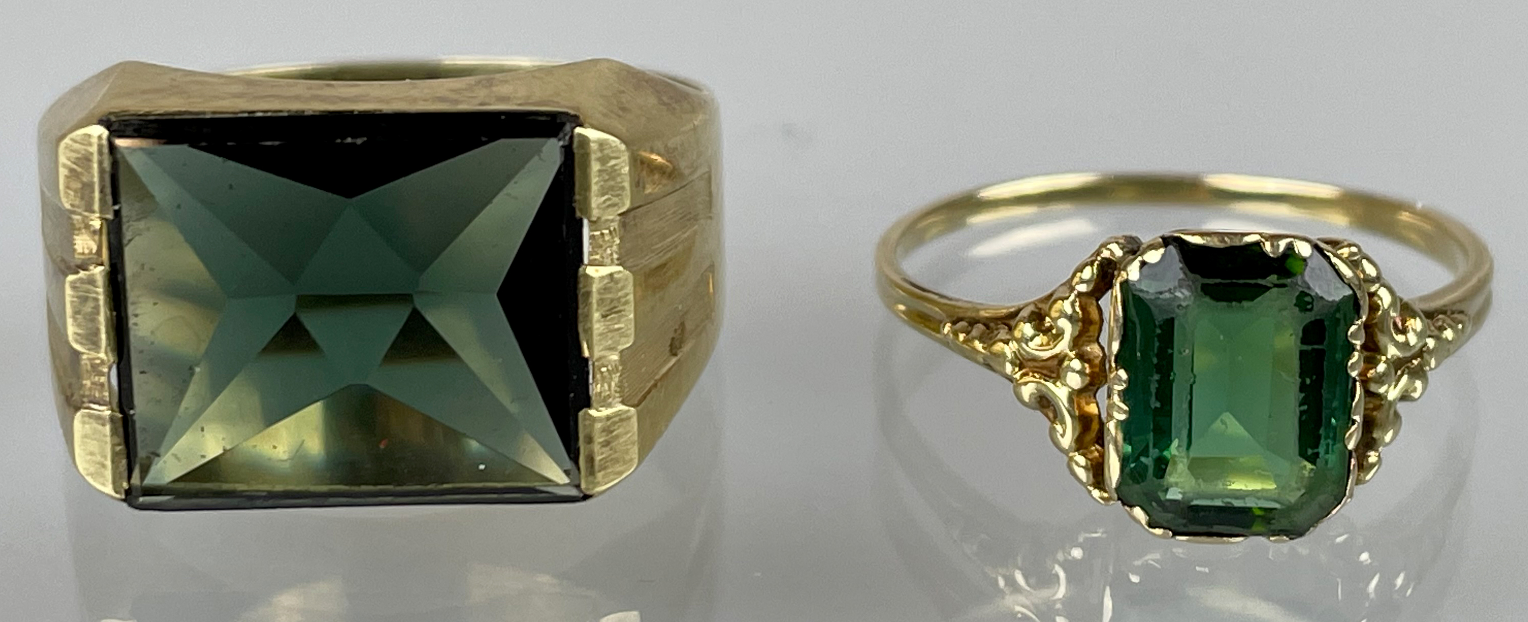 Two ladies' rings 585 yellow gold with green coloured stones.