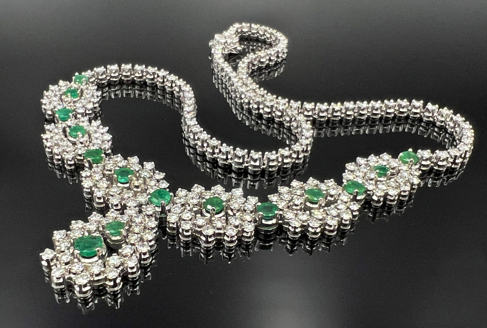 Necklace 750 white gold with lavish diamond setting and emeralds.