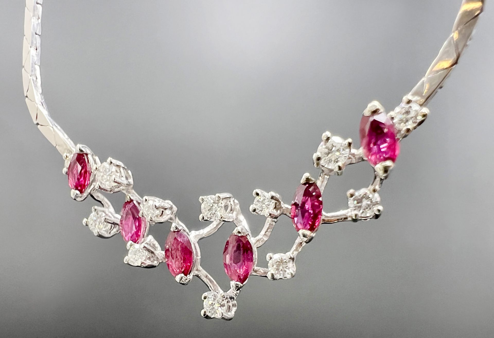 Necklace 585 white gold with rubies and diamonds.